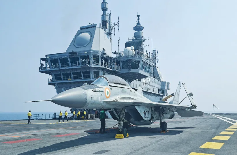 A MIG-29K fighter jet sits on the flight deck of India’s aircraft carrier ‘INS Vikrant’ during the International Fleet Review 2026 off the coast of Visakhapatnam, India.