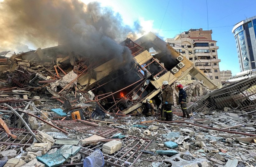 Members of the Lebanese Civil Defence inspect a damaged building after an Israeli strike on Beirut's southern suburbs, following renewed hostilities between Hezbollah and Israel amid the US-Israeli conflict with Iran, Lebanon, March 9, 2026.
