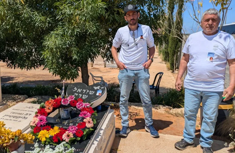 Eyal Golan, left, and his father Meir visit the grave of Eyal's sister Shirel, who died by suicide after surviving the October 7 massacre at the Nova music festival, Tel Mond, Israel, April 21, 2026.