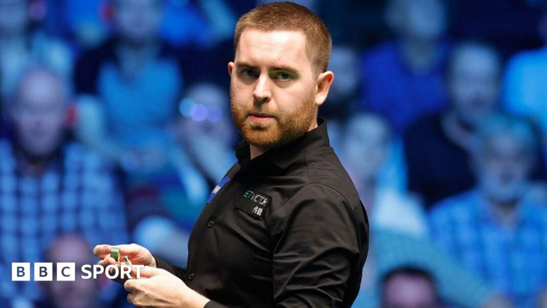 Welshman Jak Jones chalks his cue 