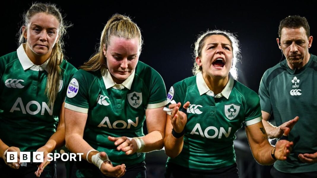 Erin King speaks to her team-mates