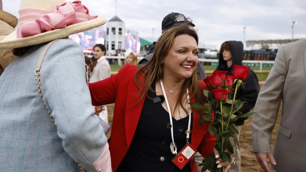 LOUISVILLE, KENTUCKY - MAY 02: Cherie DeVaux trainer of Golden Tempo #19 celebrates after becoming the first female trainer to win the Kentucky Derby during the 152nd running of the Kentucky Derby at Churchill Downs on May 02, 2026 in Louisville, Kentucky. (Photo by Michael Reaves/Getty Images)