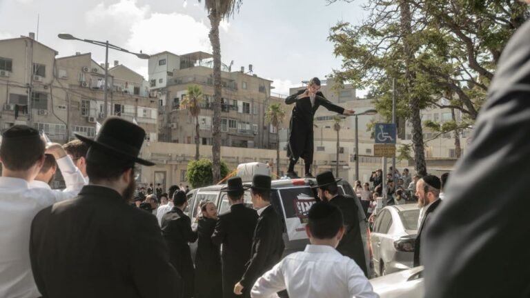 Police officer seen assaulting haredim at draft protest released after questioning