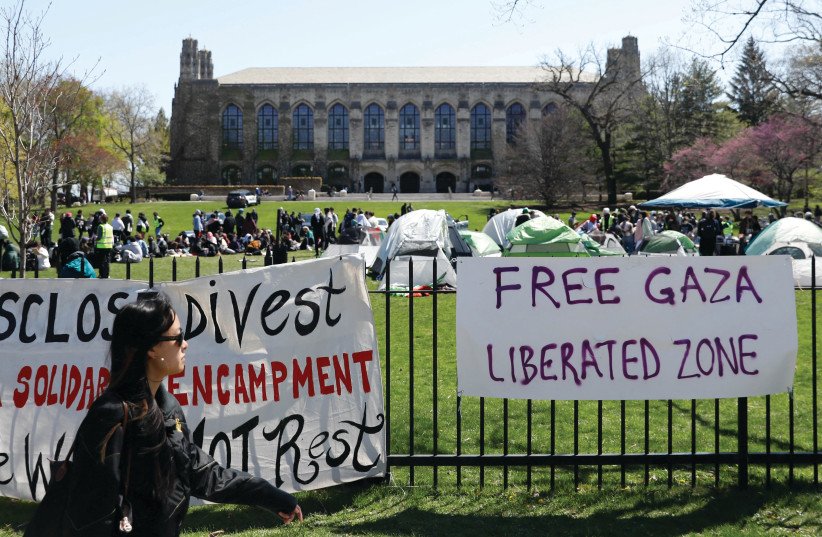 SIGNS ARE displayed in front of Deering Meadow, at an encampment of pro-Palestinian activists at Northwestern University in Evanston, Illinois in April 2024.
