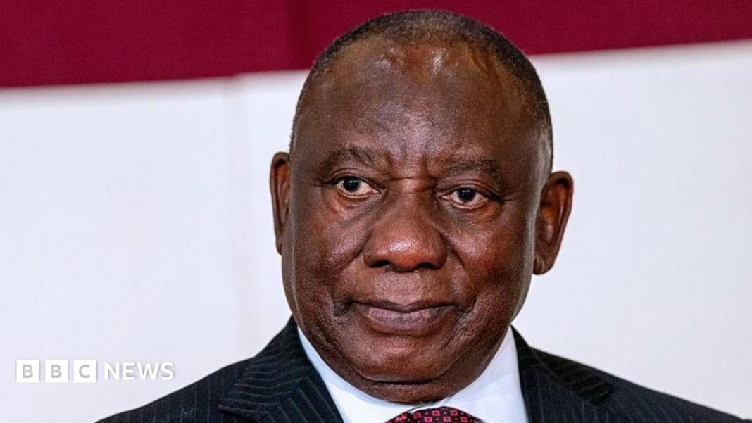 South Africa's president wins bid to temporarily halt impeachment inquiry President Cyril Ramaphosa looks on at an official event